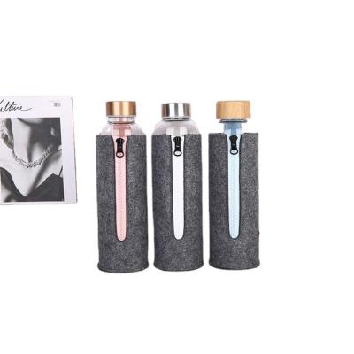 China Custom Sustainable 1000ml High Borosilicate Colored Glass Water Bottle Private Label With Felt Sleeve for sale