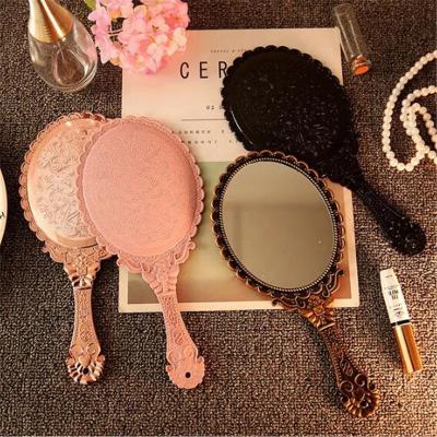 China Double Sided In RTS Running Travel Handy Make Up Mirror Cosmetic Handheld Mirror With Handle Vintage Carved Handheld Vanity Mirror for sale