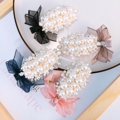 China MHC032 Good Quality Simple Design Bow Hair Clip Pearl Acrylic Hair Clip for sale