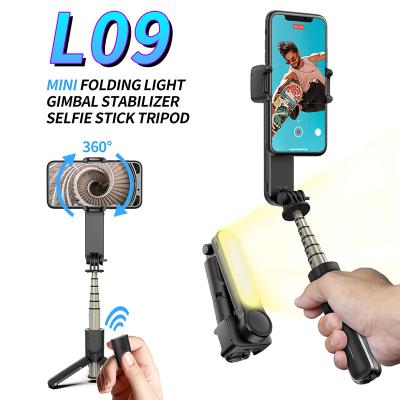 China Detachable Lightweight Handheld Rotating Phone Gimbal L09 Gimbal Sufficiency Video Stabilizer with Led Selfie Stick Lightweight Wireless Tripod for sale