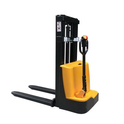 Cina 2 Ton Walk Mini Electric Stacker Forklift Electric Reach Transpallet Pallet Power Straddle Stacker Price in vendita