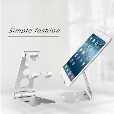 China Amazon Hot Selling Adjustable Double Folding Phone Holder Aluminum Phone Stand Custom Logo Folding Mobile Phone Desktop Bracket for sale