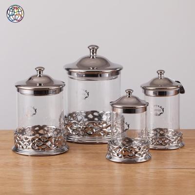 China Multi-Dimensional Kitchen Viable Embossing Luxury Silver Glass Jar With Lids for sale