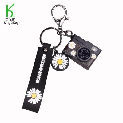 China Daisy Keychain Cute Bag Pendant Creative Plastic Camera Daisy Key Chain Small Plastic Gift for sale