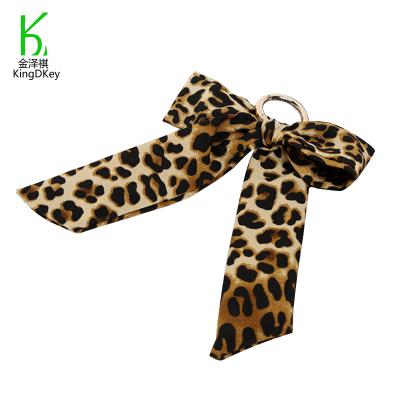 China Fashionable Soft Handmade Bow Print Fabric Silk Bow Leopard Scarf Silk Bow Key Chain for sale