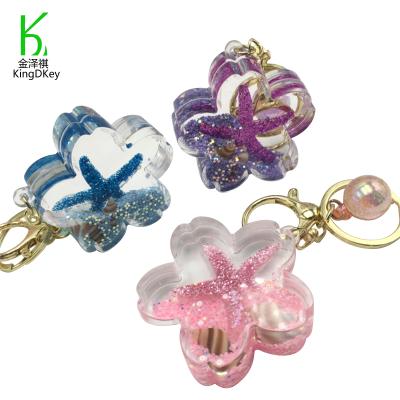 China Plastic factory direct Key Chain Cherry Blossom Shaped Acrylic Starfish Shell Sequins Decoration Moving Liquid Quicksand Keychain for sale