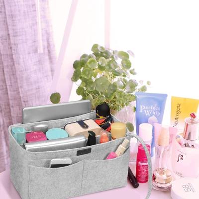 China Fashion Premium Hot Selling Gray Felt Bag Cosmetic Soft And Oiletry Felt Makeup Bag Custom Logo Durable Foldable Pouch Women Makeup Bag for sale