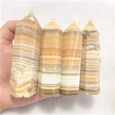 China Wholesale Natural Quartz Crystal Tower For Healing from Europe Crystal Wand Point Yellow Orange Calcite for sale