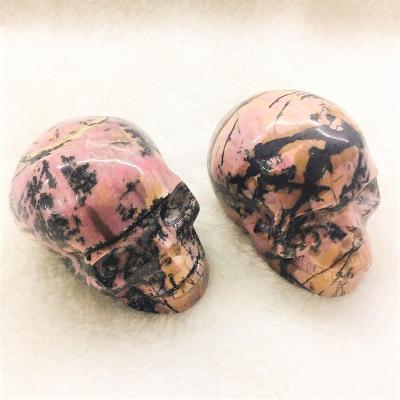 China Europe Wholesale Natural Rhodonite Semi Precious Stone Polished Crystal Skulls Crystal Crafts for sale