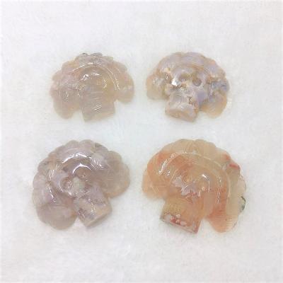 China Wholesale Natural Flower Skulls Indian Crystal Skulls Hand Carved Cherry Flower Europe Agate Skulls for sale