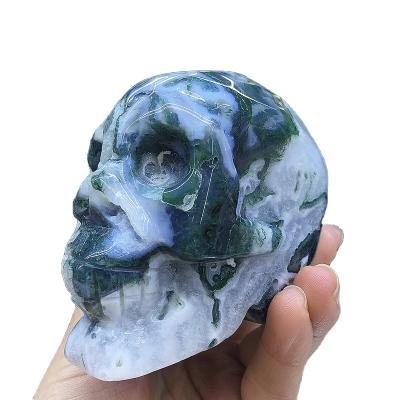 China Europe Hot Sale Customize Hand Carved Big Natural Moss Agate Quartz Crystal Skulls for sale