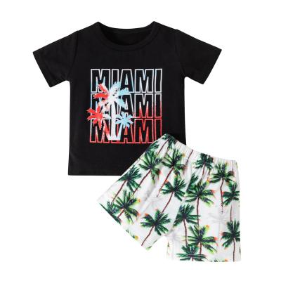 China 2022 New Style Casual Beach Children's Clothing Boys Coconut Short Sleeve Letter Printed Short Sleeve Shorts Two Piece Set for sale