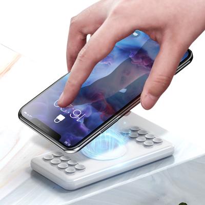 China 2 in 1 Wireless Charging Power Bank Real 10000 Mah Dual USB Port Suction Cup Power Bank Portable Wireless Charger for sale