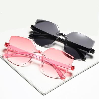 China All-in-one Candy Color Ocean Piece Transparent Sunglasses Ladies Cat Ear Sunglasses Frameless Jelly Retro Fashion Sun Glasses for sale