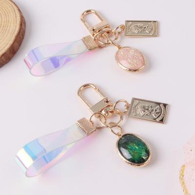 China Handsome Personality Rainbow Bag Gradient Pink Laser Leather Key Chains Eco Friendly Gemstone Pendant Wholesale for sale