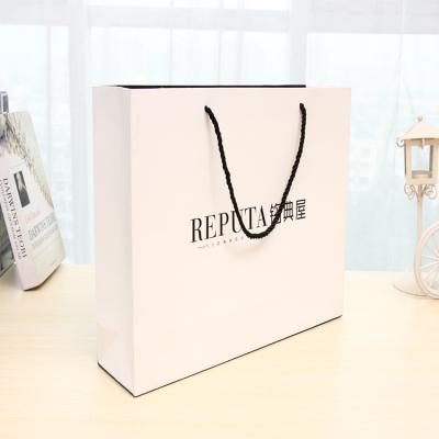 China Recycled Materials Manufacturer Direct General Purpose Portable Shopping Bags For Clothes And Shoes Custom Shopping Paper Bag With Logo for sale