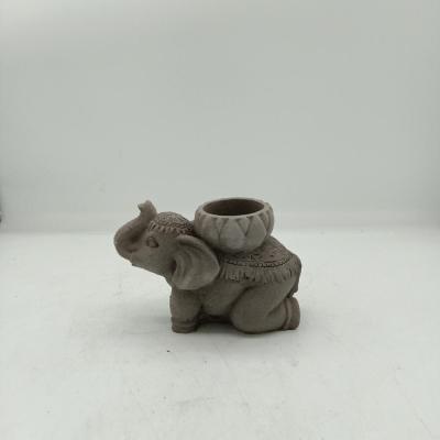 China Eco-friendly Elegant Sandstone Candle Holder Sculpture Elephant Cement Design Concrete Candle Holder for sale