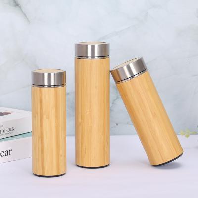 China Sustainable Drinking Water Double Wall Bamboo Vacuum Insulated Bottle Water Bottle With Customized Logo With Customized Lid for sale