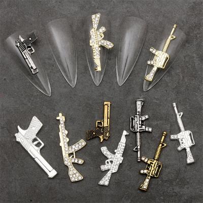 China America 2023 New design Alloy 3D Gun Shape Nail Art Decorations Luxury Punk Accessories Rhinestones GUn Nail Charms for sale