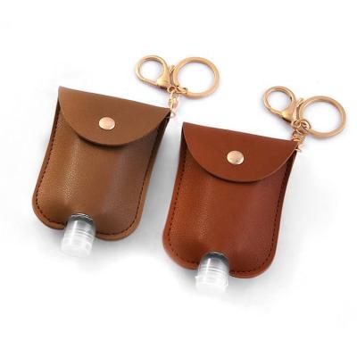 China Europe Fashion Trendy Travel Leather Hand Sanitizer Bottle Refillable Bottles With Chain Holder Bottle Key Hand Sanitizer Container for sale