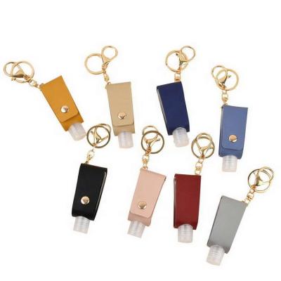 China Europe Travel PU Leather Portable Empty Leakproof Plastic Bottle For Hand Sanitizer Tassels Leather Key Chain Holder Carriers for sale