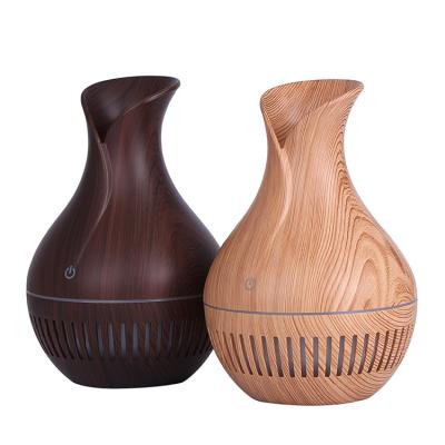 China Humidify+aromatherapy Wood Grain Oil Diffuser,Hollowing Design Essential Oil Purifying Oil Diffuser Creative New Humidifier for sale