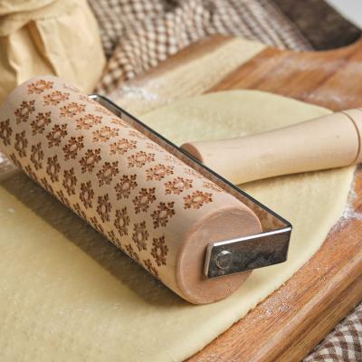 China Sustainable Processing of beech small T - shaped surface pusher daily roller rolling pin wooden kitchen supplies for sale