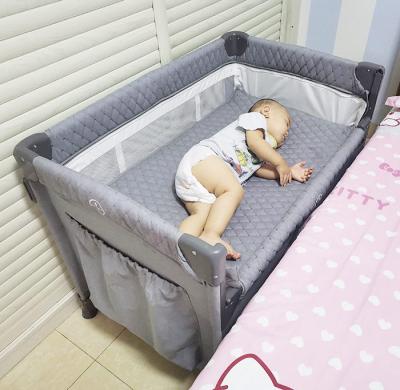 China Modern multi function baby cribs newborn foldable crib cunas gray cosleeper playard with big storage bag for sale