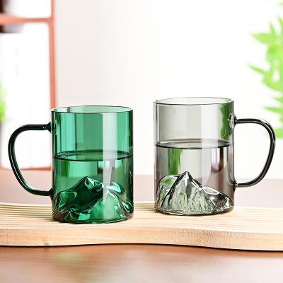 China Sustainable 400ml high borosilicate Mountain View Creative Glass tea cup with handle for sale