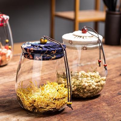 China Freshness Preservation kitchen high borosilicate beauty tea food glass storage jar with cloth lid for sale