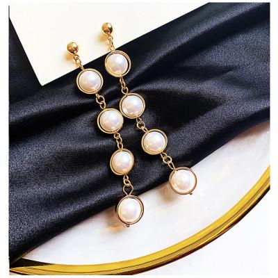 China Wholesale New Temperament Tassel Pearl Hawaiian Cocos Cring Pearl Earrings Female Polynesian Jewelry Imitation Simple Hawaiian Earrings for sale