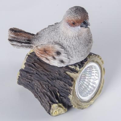 China Solar Europe Singing Bird Sitting On House Statue Sensor Garden Lighting For Sale for sale