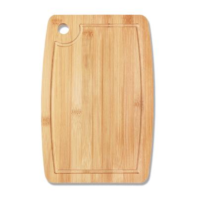 China Disposable Oval Bamboo Wooden Cutting Board with Juice Groove for Cutting Meat Vegetable Fruit for sale