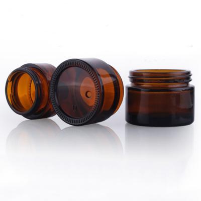 China Round 50g Cosmetic Amber Cosmetic Glass Jar For Face Cream Package for sale