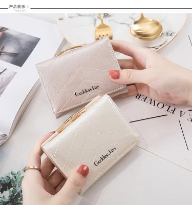 China 2022 Waterproof Fashionable Embossed Leather Wallets Folding Women's Bag Short Purses and Handbags for Women Carteras for sale