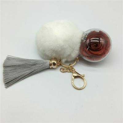 China Hanging Decoration Wholesale Vermilion Color Preserved Roses Flower Ball Key Chain Durable Key Rings for sale