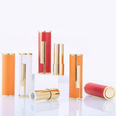 China Newest LZ Lipstick Pack Stock 100pcs Gold Filling Metallic Lift Up Lip Balm Tubes 12.1mm Tubes 12.1mm Red Orange White Leather Empty Lipstick Tube for sale