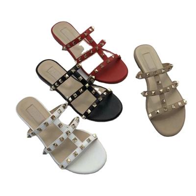 China Famous Luxury New Designer Shoes Rivet Lightweight Jelly Flat Casual Slipper Famous Luxury Leather Sandals For Women for sale