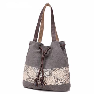 China Printing Canvas Drawstring Handbags Bucket Interior Slot Or Cellphone Pocket for sale