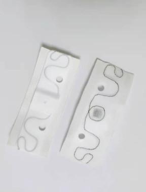 China RFID silicon gel laundry tag LAU002H , RFID UHF Laundry Tag 200 Times Washing Cycles ,  RFID laundry tag with holes for sale