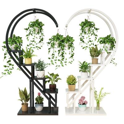 China Creative Simple Floor Standing Flower Planter Stand New Casual Home Living Room Decorative Heart Shaped Stand for sale