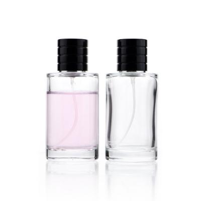 China 100ml Thick Glass Transparent Luxury Glass Perfume Bottles With Black Sprayer for sale