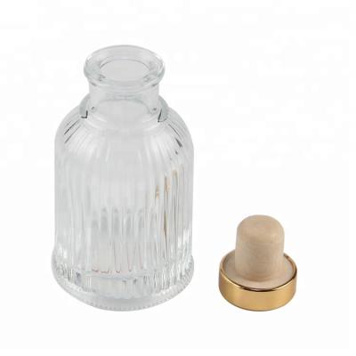 China Modern Unique Art Glass Reed Bottle Diffuser With Gold Metal Cap 100ML for sale