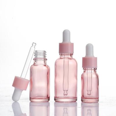 China Pink Tube Essence Glass Dropper Personal Care Essential Oil Cosmetic Dispensing Bottle for sale