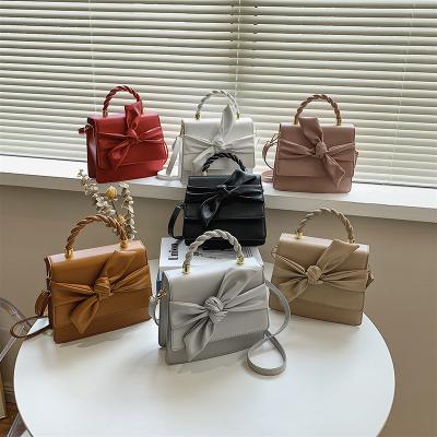 China Portable High Quality Fashionable Light Pink PU Bowknot Bags 2022 Ladies Handbag Luxury Totes for sale