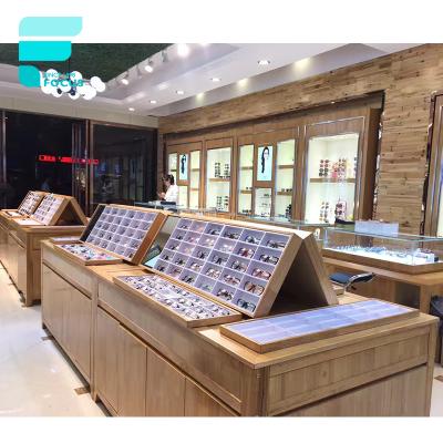 China MDF shop furniture design glass optical display stand and wall mounted display showcase for sale for sale