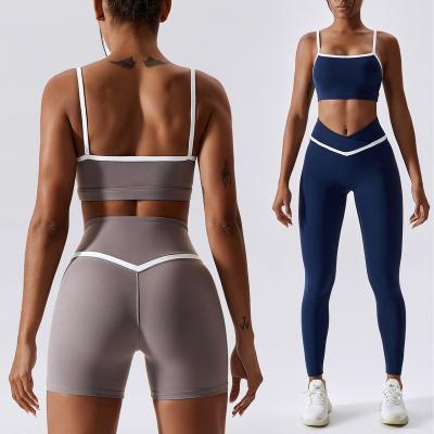 China Reversible Yoga Sets Women Color Block Workout Clothing Sports Bra V Waist Butt Lifting Yoga Leggings Gym Fitness Set for sale