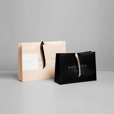 China Recyclable luxury boutique retail shopping gift packaging custom printed small black paper bag with your own logo for sale