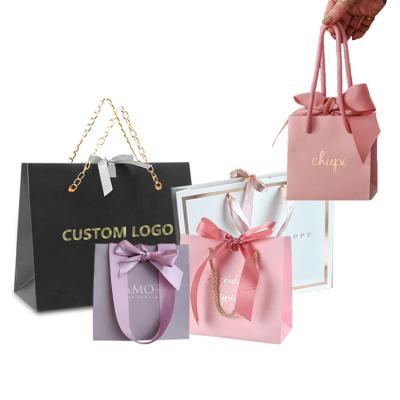 China Custom Printed Matte Black Luxury Retail Shopping Bags Recyclable Private Label Clothing Store Packaging Art Paper Shopping Bags With Logos for sale