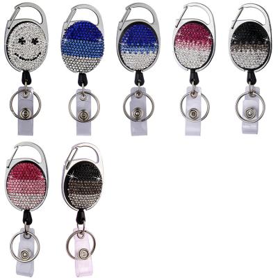 China Business Advertising Promotional Gifts Smile Face Crystal Diamond Badge Reel Card Holder Bling Oval Rhinestone Yo-Yo Badge Reel With Clip Hook for sale